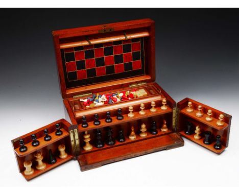 A VICTORIAN MAHOGANY GAMES COMPENDIUM with chess pieces, dice etc., with fitted interior and hinged lid, 33cm wide