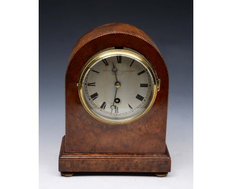 A WALNUT MANTEL CLOCK, the case with dome top and inlaid decoration, the circular steel dial signed Goldsmiths & Silversmiths