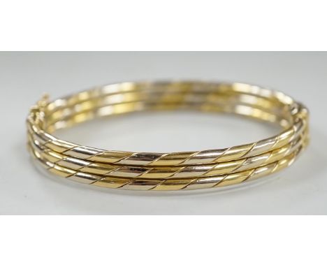 A 20th century Italian two colour 750 hinged bangle, 20.3 grams.