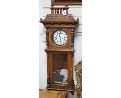 A weight driven Vienna walnut wall clock