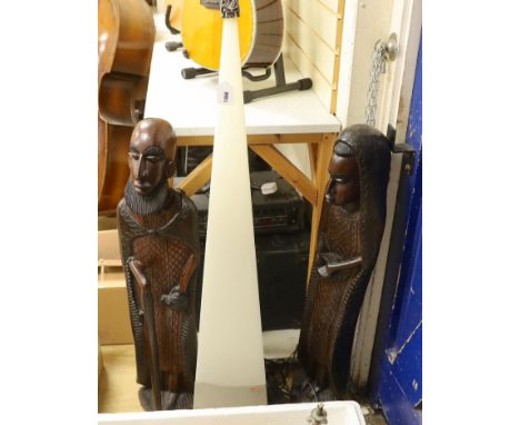 A pair of large African hardwood figural carvings and a Mathmos floor lamp