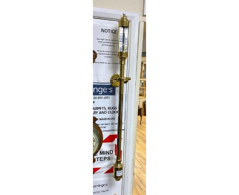 A reproduction brass ship's barometer and thermometer with gimbal mount, height 92cm