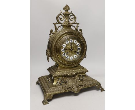 A late 19th century French Louis XIV revival brass drum shape clock, 46cm tall