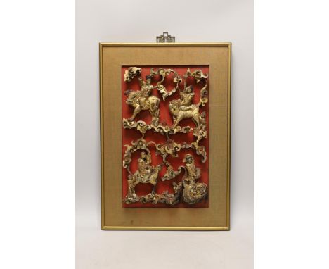 A Chinese framed gilded and lacquered wood panel, 35cm high, 22cm wide