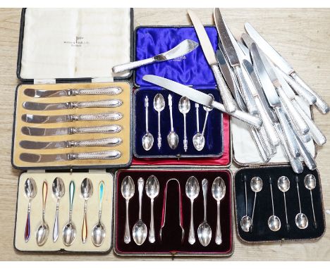 A cased set of six George V silver and polychrome enamel coffee spoons, Barker Brothers Silver Ltd, Birmingham, 1932, four ot