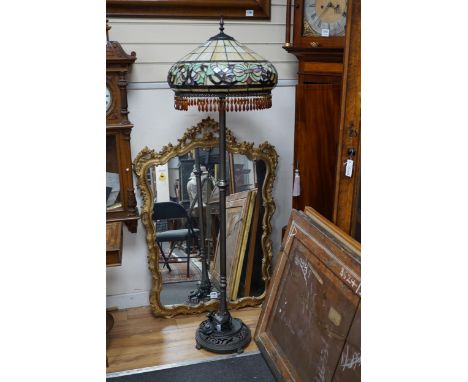 A Tiffany style leaded glass and bronzed metal lamp standard, height 164cm
