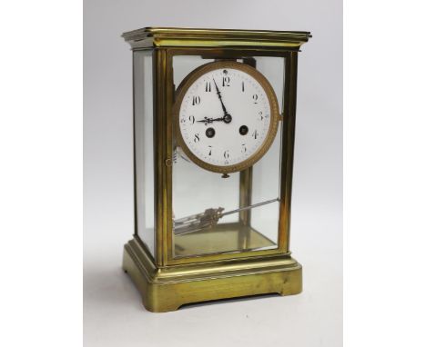 An early 20th century brass four-glass clock with mercury pendulum, 28cm high