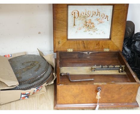 An early 20th century walnut cased polyphon and thirty discs