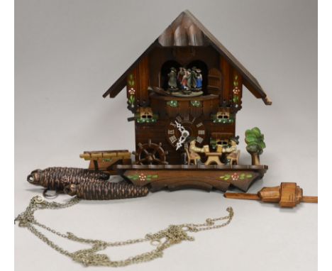 A Schneider German carved wood cuckoo clock