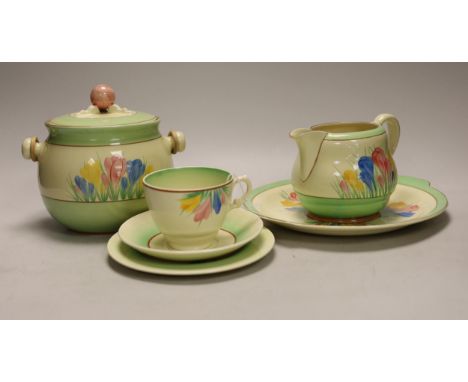 Clarice Cliff  ‘Spring Crocus’: a trio, a cake plate, a jug and a biscuit barrel and cover, 17cm high (6)