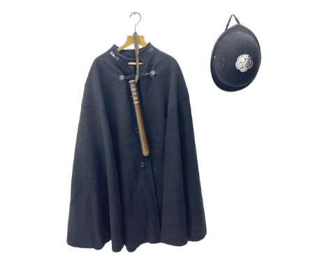 Police Constabulary style uniform items comprising woollen night cape / cloak with chain fastening, helmet and truncheon