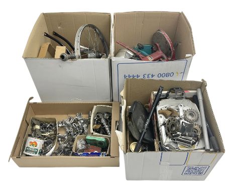Collection of motorcycle and bicycle parts, tools and similar equipment, to include seats, lights, pedals, brakes and two dri