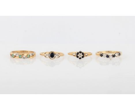 A collection of four various hallmarked 9ct yellow gold gemstone rings, gemstones to include sapphire, diamond, emerald and c