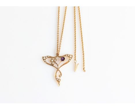 An Edwardian amethyst and seed pearl open metalwork pendant, indistinctly stamped, on a belcher link chain (A/F chain is miss