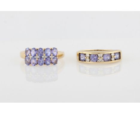 Two hallmarked 9ct yellow gold tanzanite and diamond rings, one of half eternity design, the other of two row design, ring si