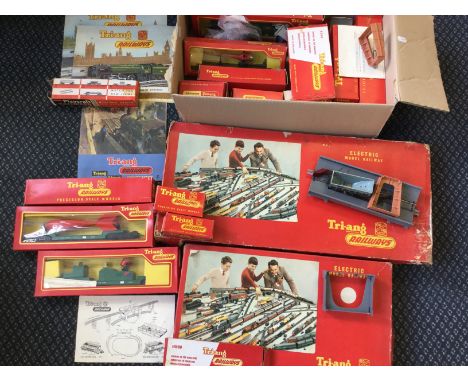 A selection of Tri-ang model vehicles, with two electric model railways RS 1 and RS 2, magazines, rolling stock and other acc