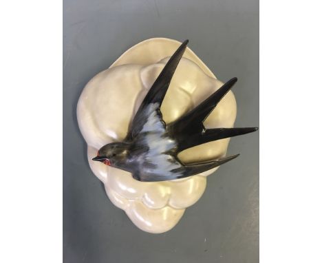 A Clarice Cliff swallow wall pocket.