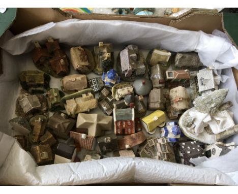 A box containing model houses, Lilliput Lane and cherished teddy bears.