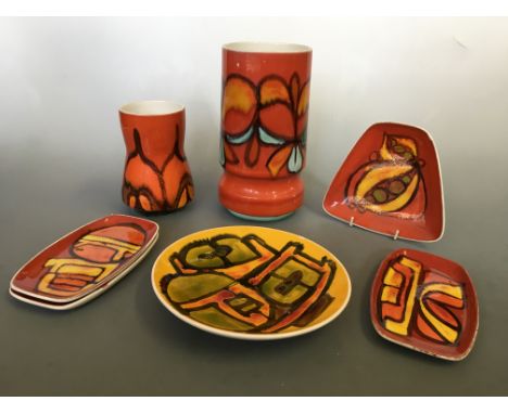 A collection of Poole Pottery in yellow, green, blue and orange designs including six vases, dishes, plates, side plates, etc