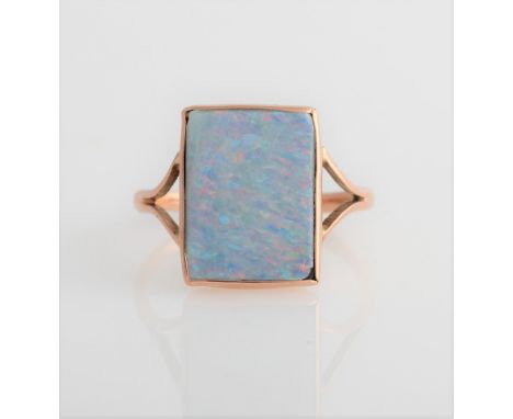 An opal ring, set with a square opal doublet, measuring approx. 10x13mm, stamped England 9ct, ring size N.