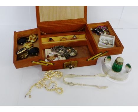 A brown leather jewellery box containing a 9 carat gemset dress ring, silver bangle Ciro pearls  and a collection of costume 