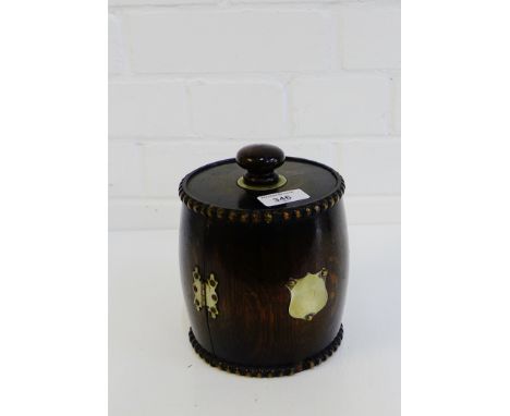 An oak pipe stand of barrel form with blank Epns shield cartouche, 18cm high