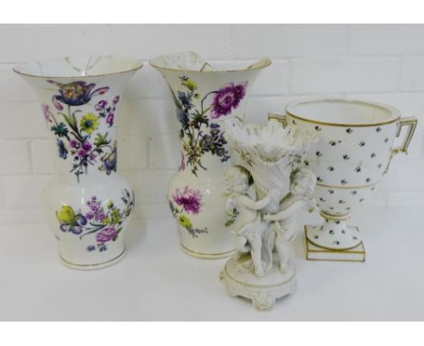 A pair of Meissen porcelain floral pattern vases with blue cross sword marks to base, together with a bisque cupid vase and a