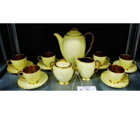 Carlton ware yellow glazed coffee set with gilt handles and interiors comprising coffee pot, twin handled sugar bowl and cove