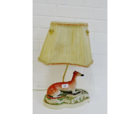 A Staffordshire 'Hound and Hare' figural table lamp base and shade