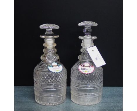 A pair or triple ring neck decanters with flat stoppers and enamelled sherry and whiskey decanter labels, 26.5cm high,  (a lo