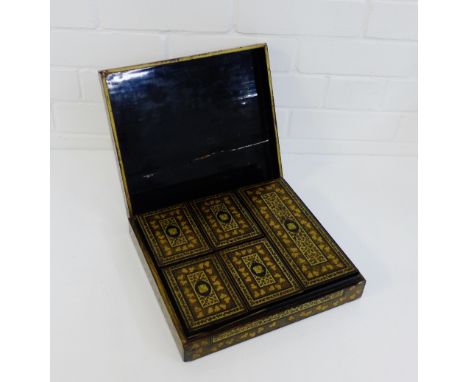 A lacquered rectangular box containing an assortment of five smaller boxes to the interior each containing a collection of bo