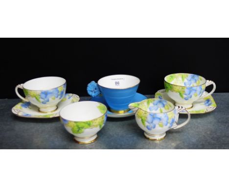 A Paragon Art Deco blue glazed cup and saucer, the cup with butterfly handle, together with a collection of Paragon 'Honesty'