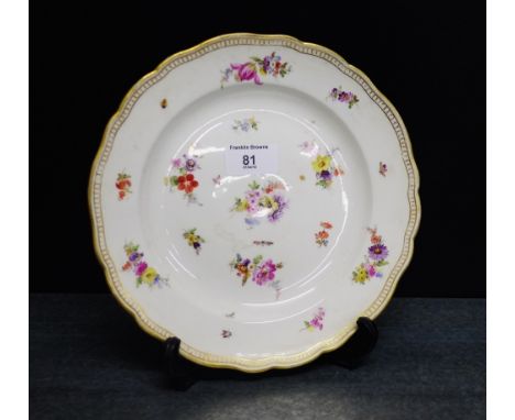 A Meissen cabinet plate painted insects and floral spray pattern within a gilt rim, diameter 23cm