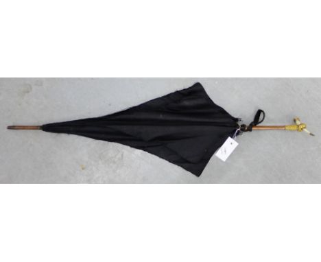 A vintage parasol with a mother-of-pearl and a gilt metal handle