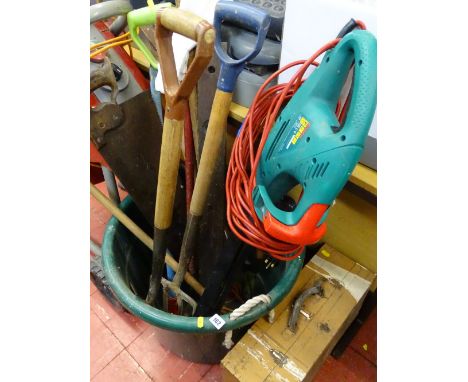 Large plastic garden bucket with contents of long handled garden tools, spirit level and manual saw, Bosch hedge trimmer and 