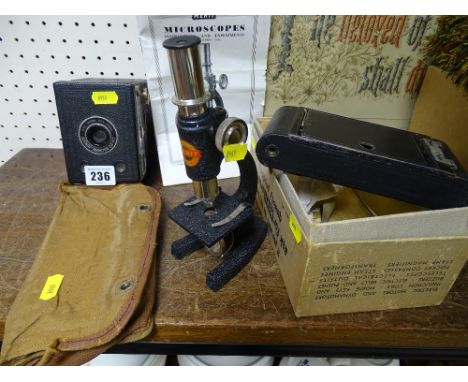 6-20 Brownie Jnr boxed camera, similar era camera in a case and a small microscope