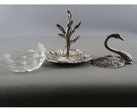 Silver ring tree, the tree base decorated with winged cherub heads and a Continental white metal and cut glass swan (care nee
