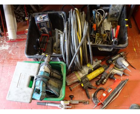 Two black tubs of garage items including grease guns and air driven power tools, quantity of hose etc
