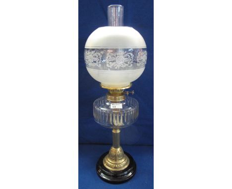 Early 20th Century brass double burner oil lamp with thumb cut glass reservoir on brass pedestal with ceramic base, etched gl