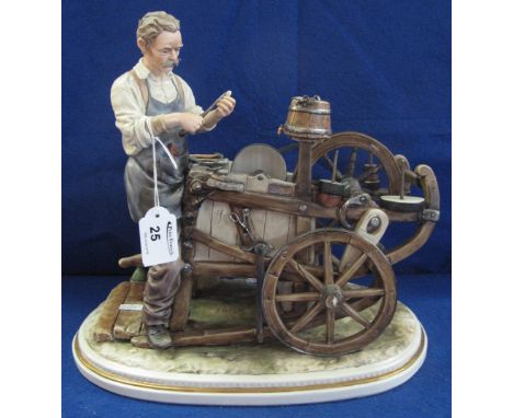 Italian Capodimonte figure group, 'The Knife Grinder with his Cart', Crowned N mark.