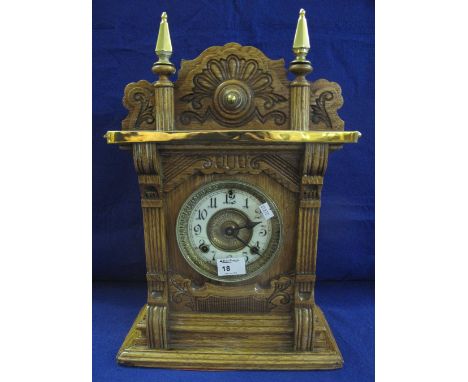 Early 20th Century American oak cased, two train mantel clock with moulded, brass mounted case and two train movement.