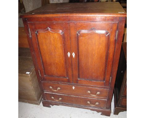 18th Century style oak blind panelled TV unit, having two long drawers on bracket feet.