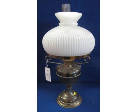 20th Century brass double burner oil lamp on pedestal base, with fluted opaque shade and clear chimney.