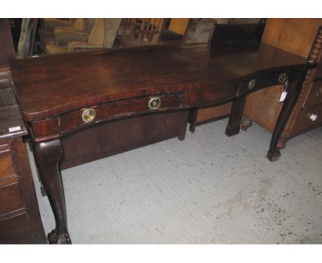 Early 20th Century mahogany serpentine shaped hall or console table having two moulded frieze drawers on cabriole front legs 