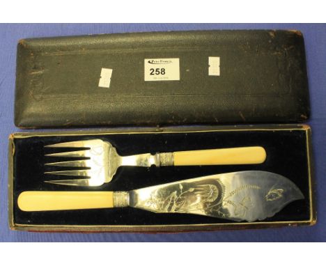 Cased, engraved fish knife and fork set.