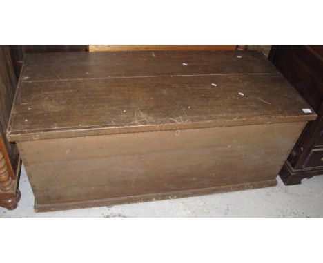 Large 19th Century stained pine trunk with metal carrying handles.