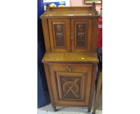 Edwardian oak cabinet with gallery top, two blind panelled doors and cupboard, carved with fox mask, horseshoe, horn and othe