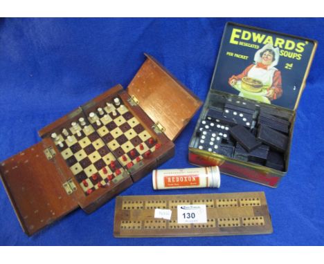 'Edward's Desiccated Soup' tin containing dominoes, mahogany cased travelling chess set and a wooden cribbage board. (2)