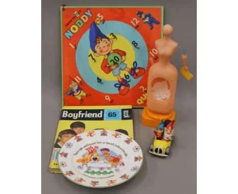 A 1965 edition of Boyfriend and a small quantity of children's toys, including Noddy and The Magic Roundabout.