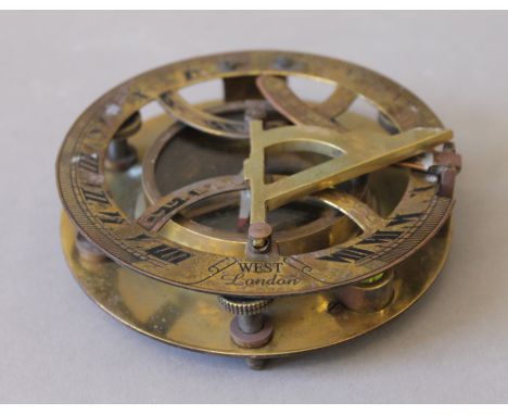 A brass sundial compass. 11 cm diameter.